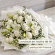 Bouquet blanc de deuil avec lys, lisianthus et roses blanches, composé par un artisan fleuriste