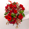 Bouquet Charme de Noël avec des roses rouges intenses et du wax blanc