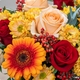 Image du Bouquet Fauve aux fleurs orange, rouges et pêche, bouquet rond aux tons chauds réalisé par 123fleurs