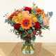 Image du Bouquet Fauve aux fleurs orange, rouges et pêche, bouquet rond aux tons chauds réalisé par 123fleurs