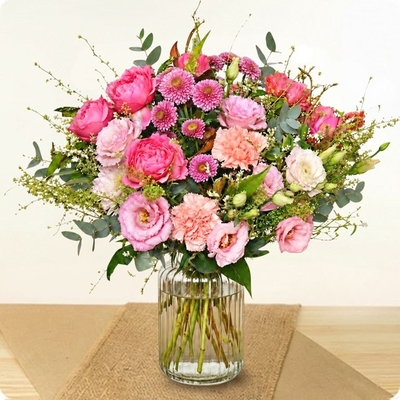 Bouquet rond dans les camaïeux de roses livré par un fleuriste 123fleurs