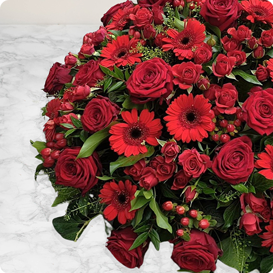 Coussin de fleurs pour deuil rouge Pour l'Éternité
