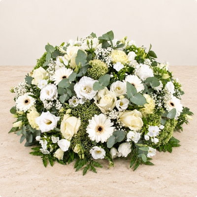 Olympia, coussin de deuil rond en roses et gerberas blancs